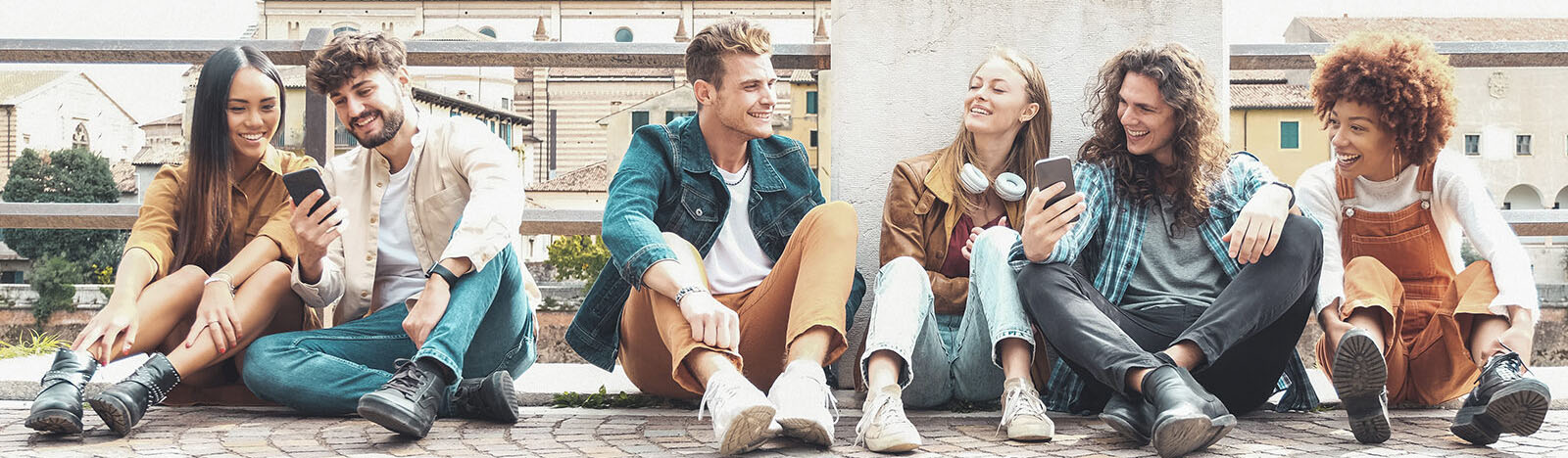 people sitting on ground and socializing